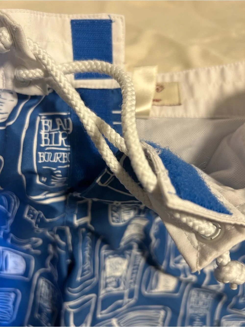 Penguin blue men’s swim trunk alcohol bottles, size 34